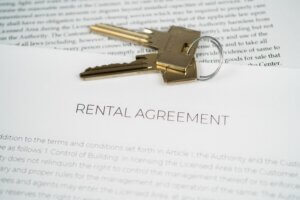 House keys resting on a residential rental agreement